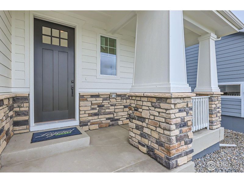 Exterior details and patio area of a home in Barefoot Lakes, Longmont (Image 3).