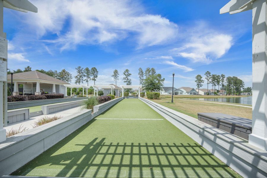Exterior details and patio area of a home in K. Hovnanian's® Four Seasons at Lakes of Cane Bay, Summerville (Image 28).
