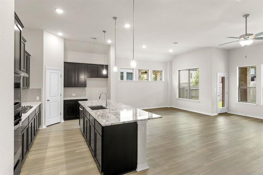 Kitchen, overlooking family & dining areas