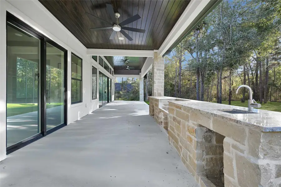Outdoor living space featuring a built-in outdoor kitchen.