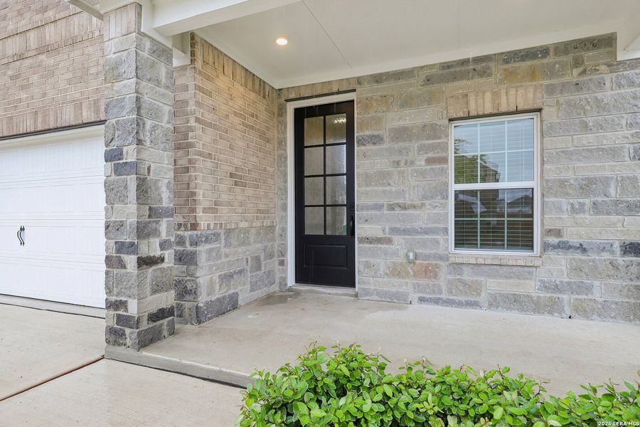 Exterior details and patio area of a home in Hightop Ridge, Converse (Image 3).