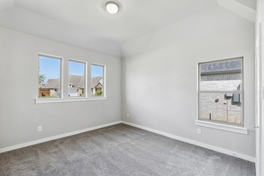 Bedroom in the Bowie home plan by Trophy Signature Homes – REPRESENTATIVE PHOTO