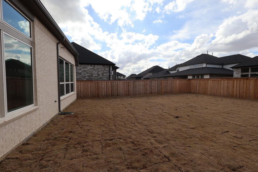 Exterior details and patio area of a home in Dunham Pointe, Cypress (Image 22). Exterior details and patio area of a home in Dunham Pointe, Cypress (Image 22).