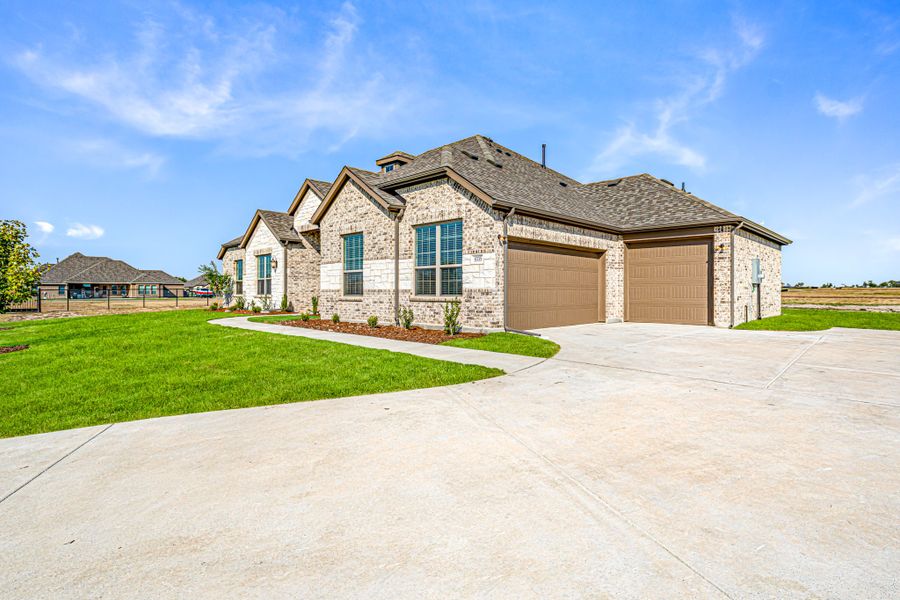 Front exterior of a new home in Creekview Farms, Greenville, TX, highlighting curb appeal (Image 26). Front exterior of a new home in Creekview Farms, Greenville, TX, highlighting curb appeal (Image 26).