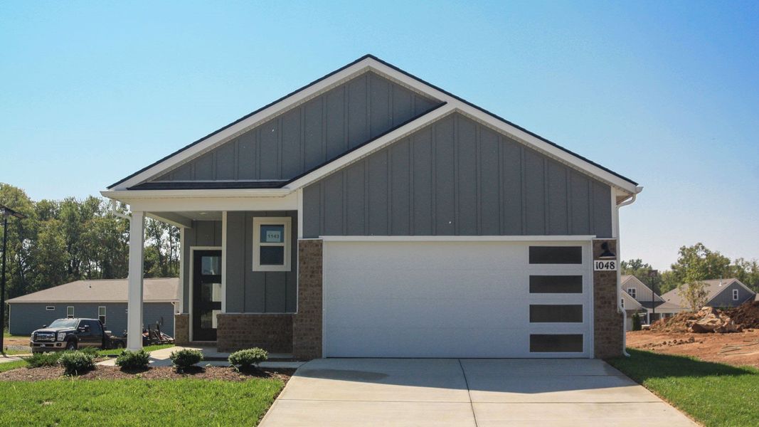 Front exterior of a new home in Nexus South, Gallatin, TN, highlighting curb appeal (Image 23). Front exterior of a new home in Nexus South, Gallatin, TN, highlighting curb appeal (Image 23).