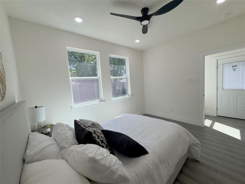 Bedroom with wood-type flooring and ceiling fan