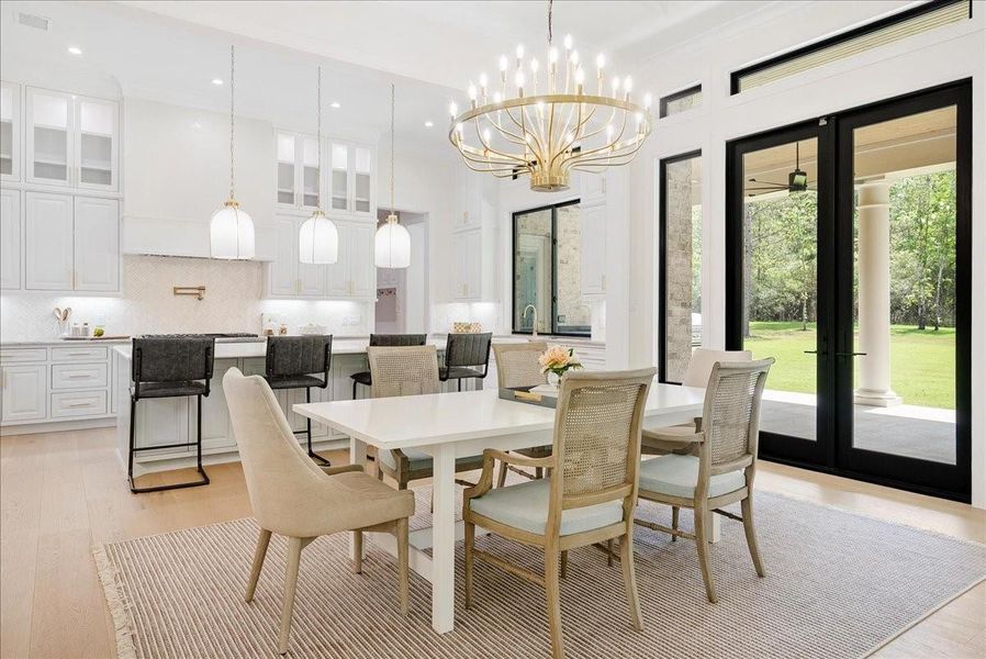 The dining room leads to the kitchen with views of the pines in your backyard throughout.