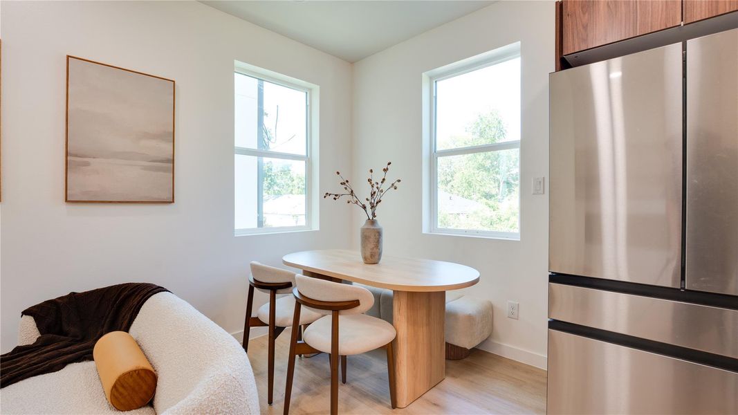 Cozy dining are features natural light
