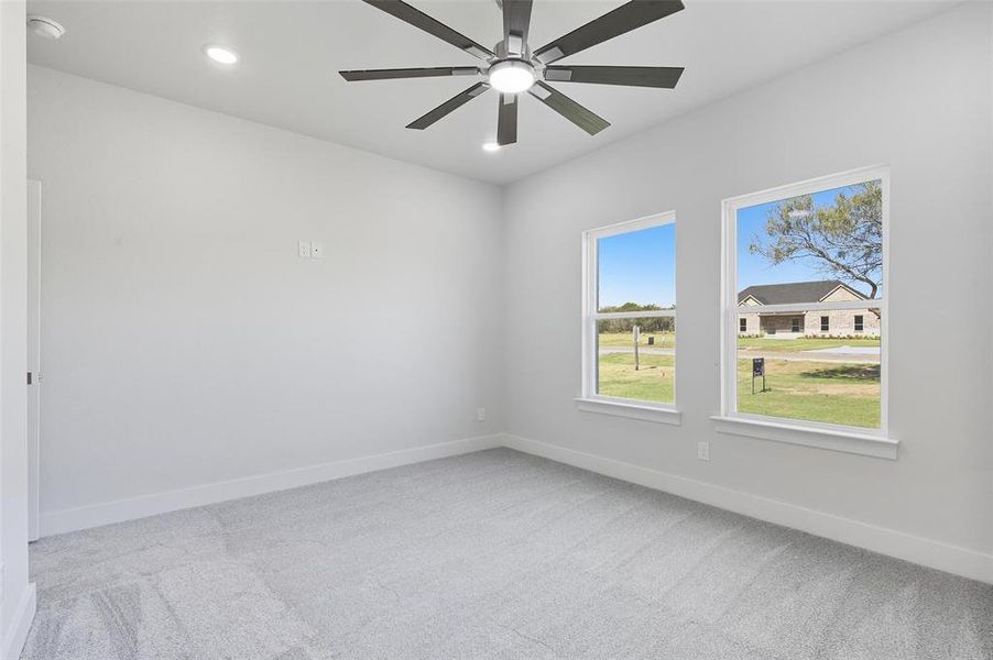 Empty room with light carpet, recessed lighting, and ceiling fan Empty room with light carpet, recessed lighting, and ceiling fan