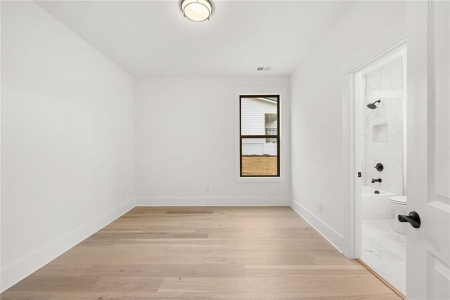 Spacious, unfurnished interior of a new home in Soleil Belmont Park, Canton (Image 49).