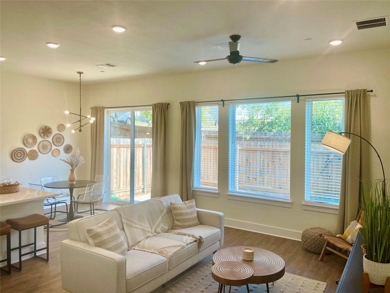 Tall ceiling and large windows bring in natural light