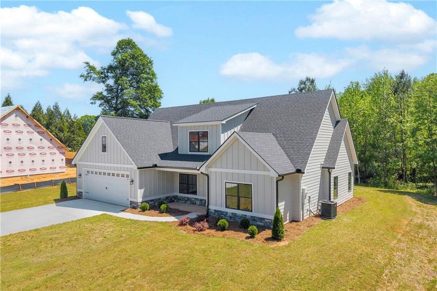 Front exterior of a new home in , Lavonia, GA, highlighting curb appeal (Image 24).