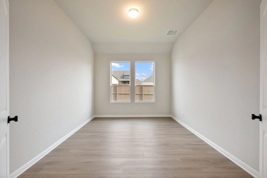 Spacious, unfurnished interior of a new home in The Colony 50s, Bastrop (Image 34).
