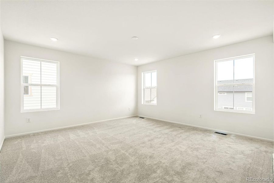Spacious, unfurnished interior of a new home in Windsong, Thornton (Image 30).