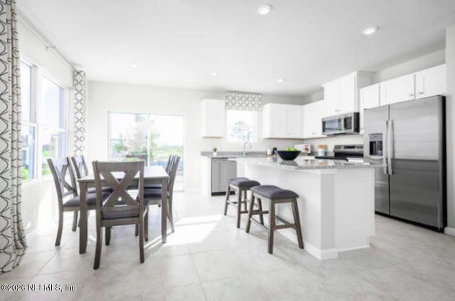 Furnished interior view inside a new home in Seminole Palms Townhomes, Palm Coast (Image 3).