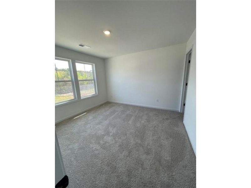 Spacious, unfurnished interior of a new home in Springwood Grove, Central (Image 17).