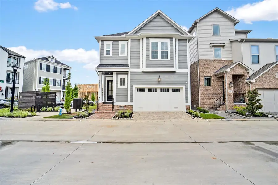 Front exterior of a new home in Reserve in Memorial, Houston, TX, highlighting curb appeal (Image 1). Front exterior of a new home in Reserve in Memorial, Houston, TX, highlighting curb appeal (Image 1).
