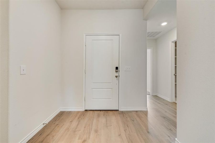Back of house at dusk with a patio area, a fenced backyard, and a shingled roof Back of house at dusk with a patio area, a fenced backyard, and a shingled roof