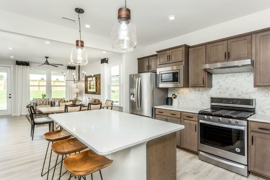 Open concept kitchen with eat-in bartop