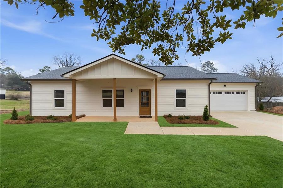 Front exterior of a new home in , Tate, GA, highlighting curb appeal (Image 15). Front exterior of a new home in , Tate, GA, highlighting curb appeal (Image 15).