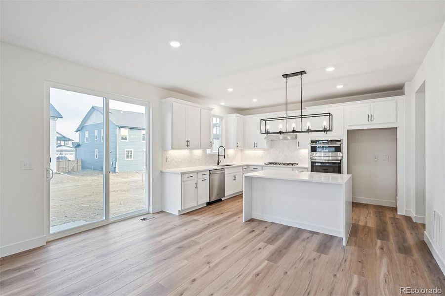 Furnished interior view inside a new home in Windsong, Thornton (Image 11).