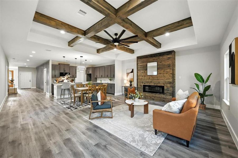 Living room featuring a fireplace, coffered ceiling, beam ceiling, light wood-style flooring, and recessed lighting Living room featuring a fireplace, coffered ceiling, beam ceiling, light wood-style flooring, and recessed lighting