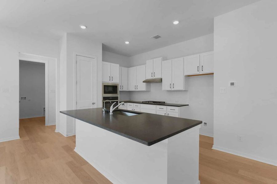 Representative furnished interior of a home built from the Aventura by Chesmar Homes in Bridgeland, Elgin (Image 3).