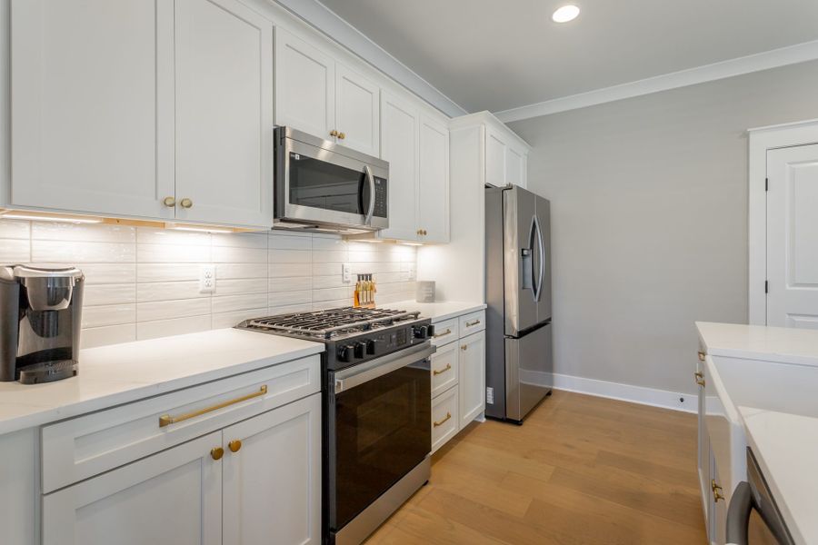 Furnished interior in a model home at Baker Road in Birchwood (Image 6).