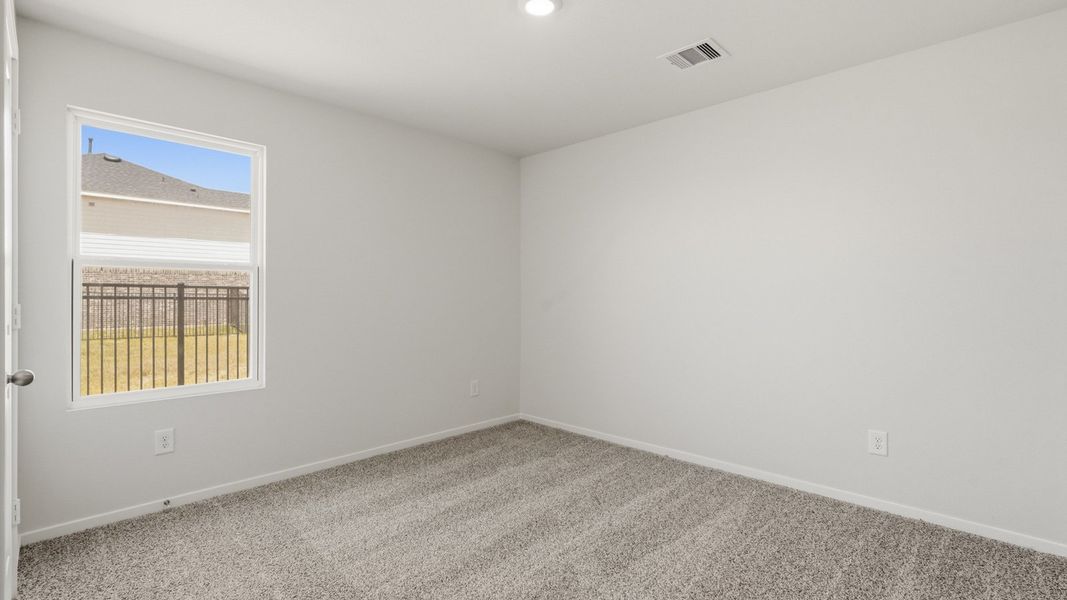 Spacious, unfurnished interior of a new home in Sunterra, Katy (Image 20).