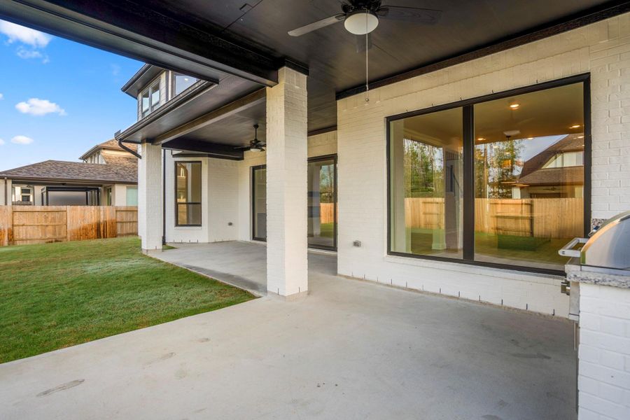 Exterior details and patio area of a home in ARTAVIA 70′ Lots, Conroe (Image 4).