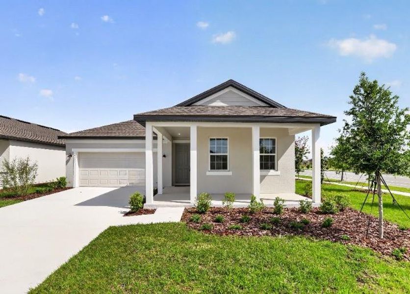 Front exterior of a new home in Sunbrooke, St. Cloud, FL, highlighting curb appeal (Image 19).