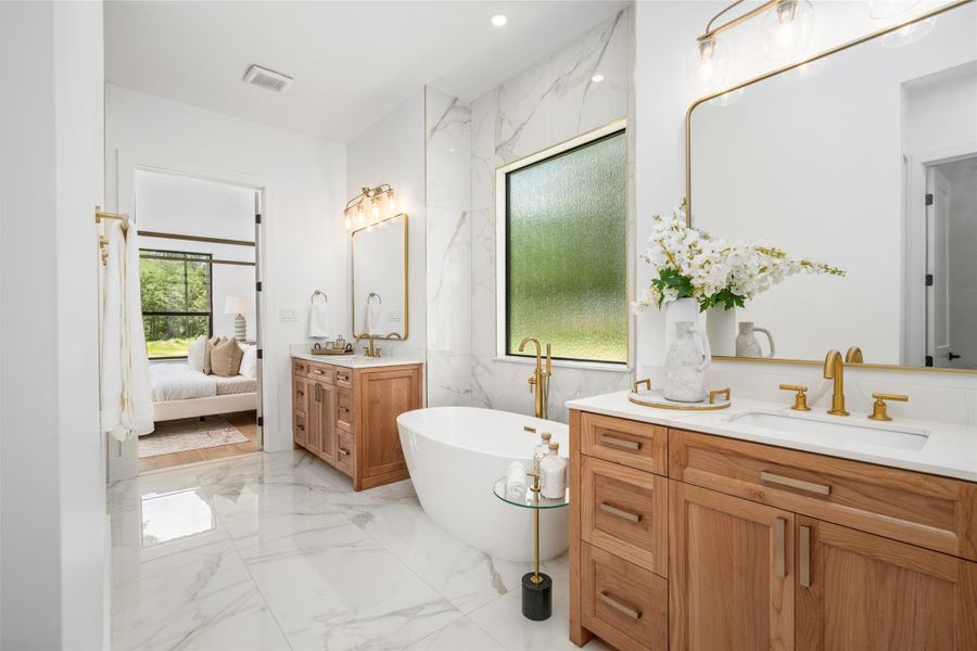 Oversized marble porcelain tiles up to the ceilings in all bathrooms. Large soaker tub with high-end finishes throughout. Oversized marble porcelain tiles up to the ceilings in all bathrooms. Large soaker tub with high-end finishes throughout.