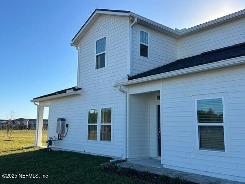 Exterior details and patio area of a home in Brook Forest - Villas, St. Augustine (Image 4).