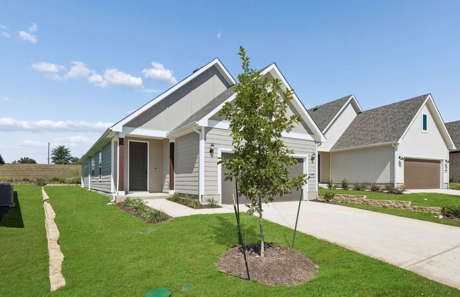 Front exterior of a new home in Sun City Texas, Georgetown, TX, highlighting curb appeal (Image 19).