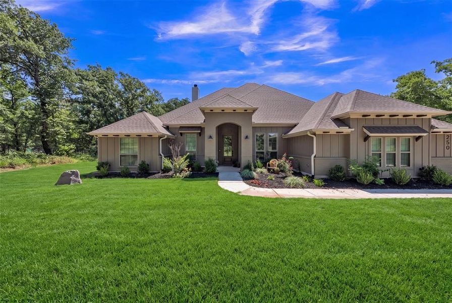 Front exterior of a new home in , Poolville, TX, highlighting curb appeal (Image 2). Front exterior of a new home in , Poolville, TX, highlighting curb appeal (Image 2).