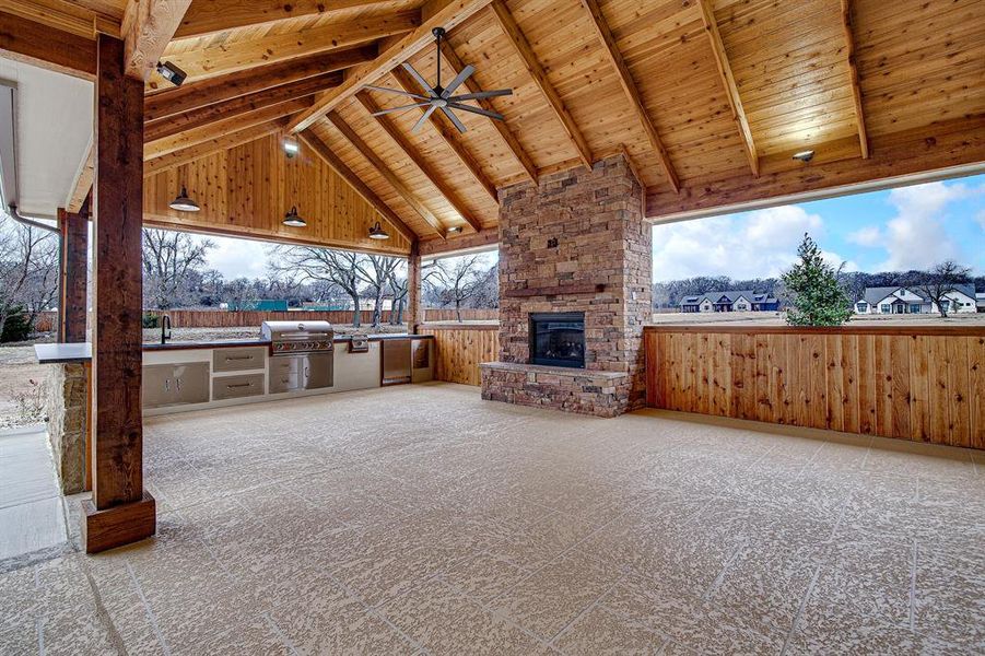 View outdoor Living with fireplace, kitchen/grilling area with Bar View outdoor Living with fireplace, kitchen/grilling area with Bar
