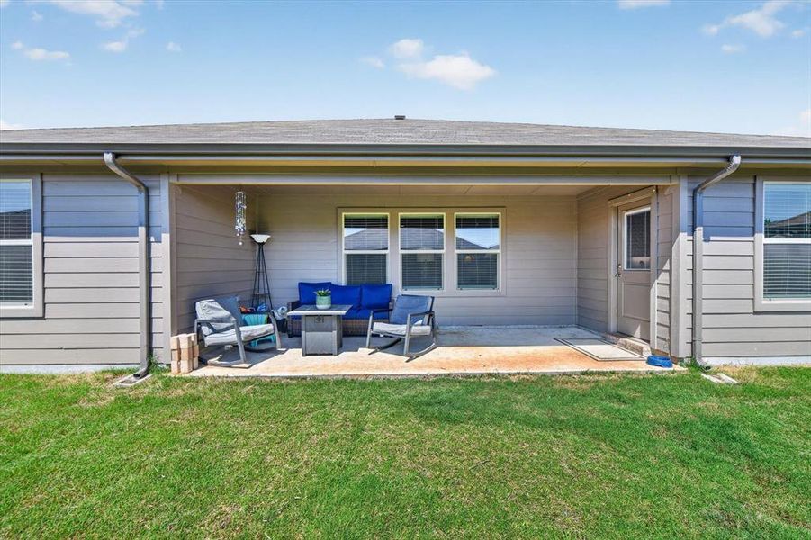 Covered patio featuring a concrete slab and direct yard access