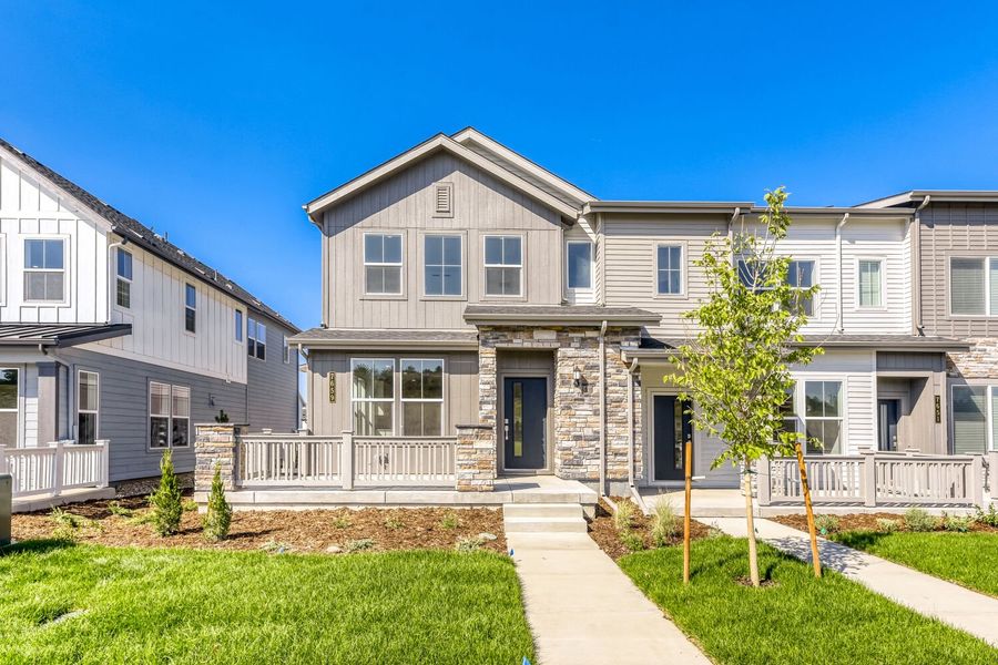 Front exterior of a new home in Vermilion Creek, Centennial, CO, highlighting curb appeal (Image 1). Front exterior of a new home in Vermilion Creek, Centennial, CO, highlighting curb appeal (Image 1).