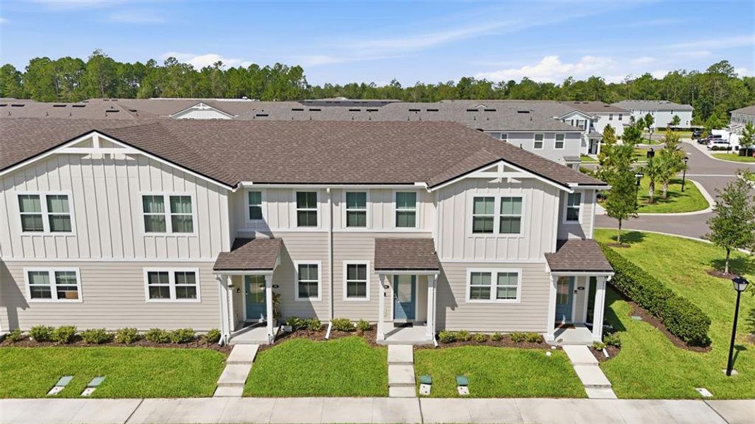 Front exterior of a new home in , St. Johns, FL, highlighting curb appeal (Image 23). Front exterior of a new home in , St. Johns, FL, highlighting curb appeal (Image 23).
