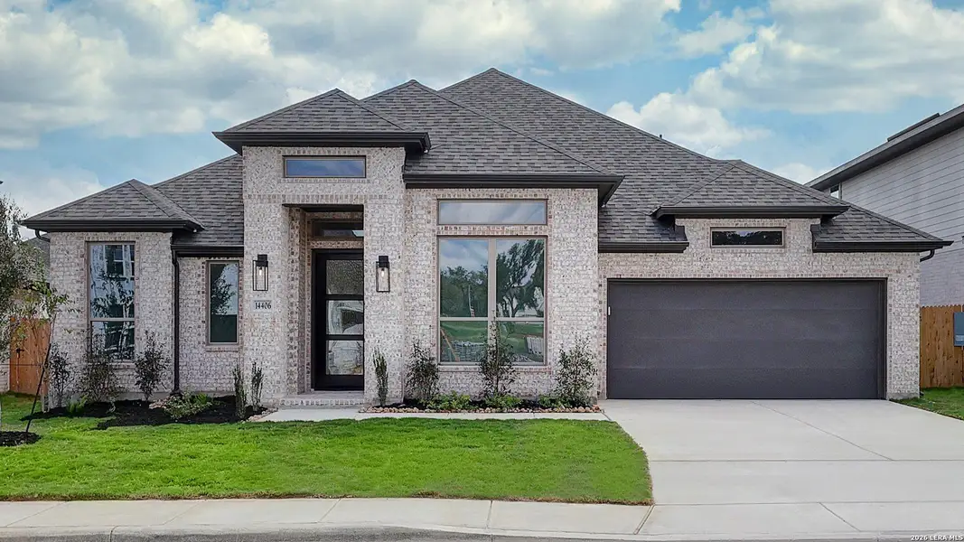Front exterior of a new home in Kallison Ranch, San Antonio, TX, highlighting curb appeal (Image 2). Front exterior of a new home in Kallison Ranch, San Antonio, TX, highlighting curb appeal (Image 2).