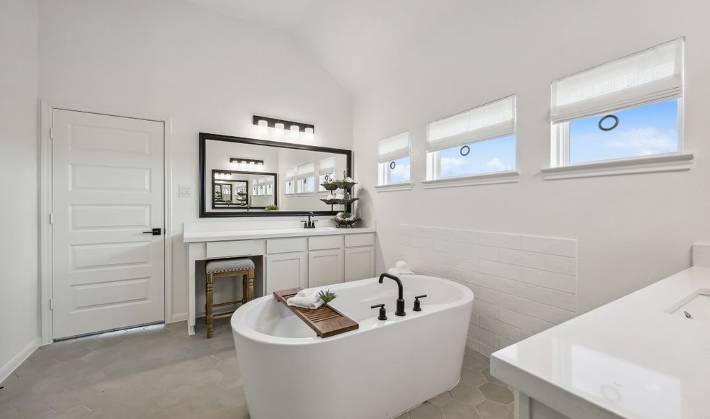 Stunning primary bath with freestanding vanity