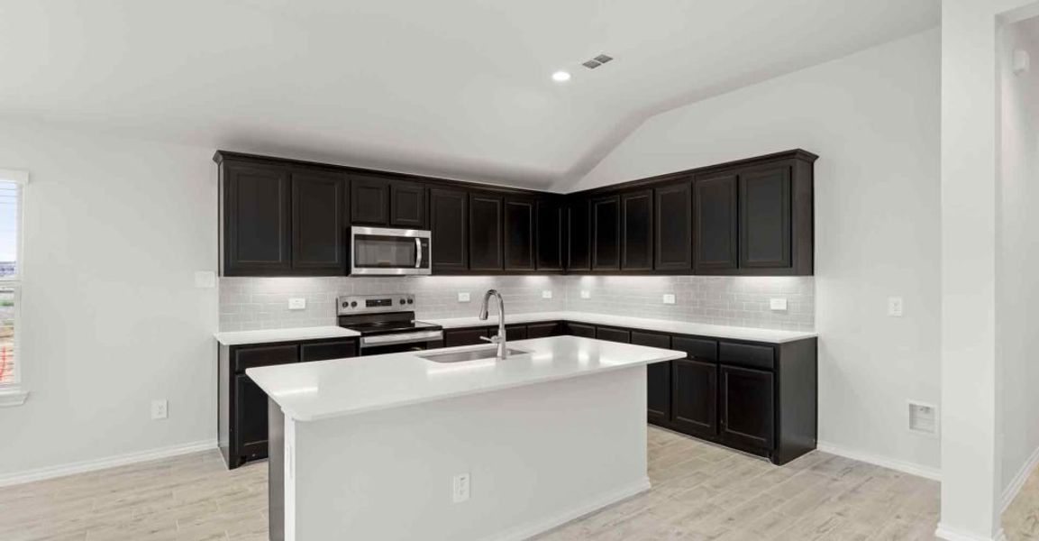 Representative exterior photo of a completed home built from the Atlanta by Impression Homes in Keeneland, Aubrey, TX (Image 5).