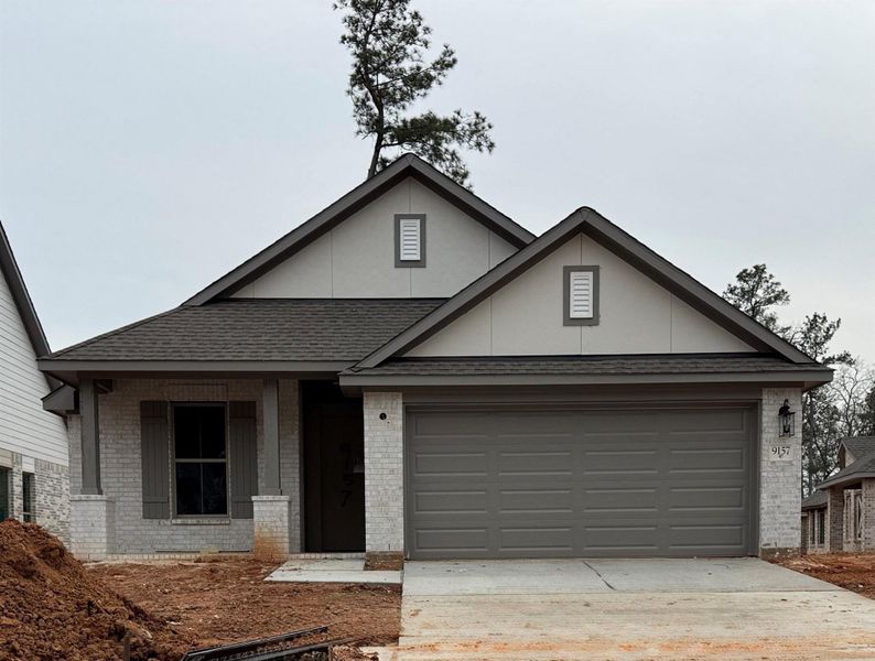 Front exterior of a new home in Two Step Farm, Montgomery, TX, highlighting curb appeal (Image 1). Front exterior of a new home in Two Step Farm, Montgomery, TX, highlighting curb appeal (Image 1).