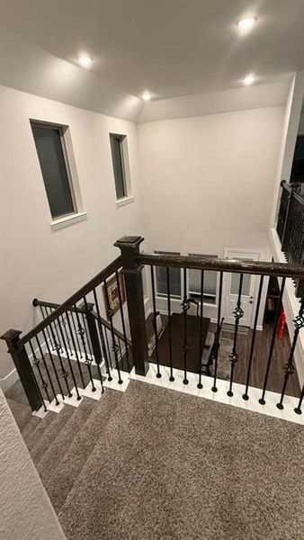 Stairs featuring carpet floors and recessed lighting