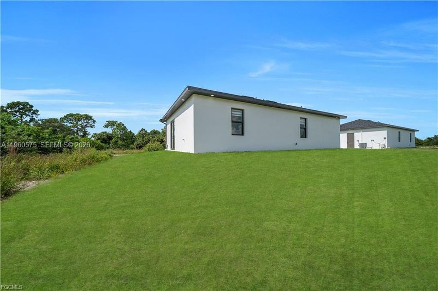 Exterior details and patio area of a home in , Lehigh Acres (Image 4).