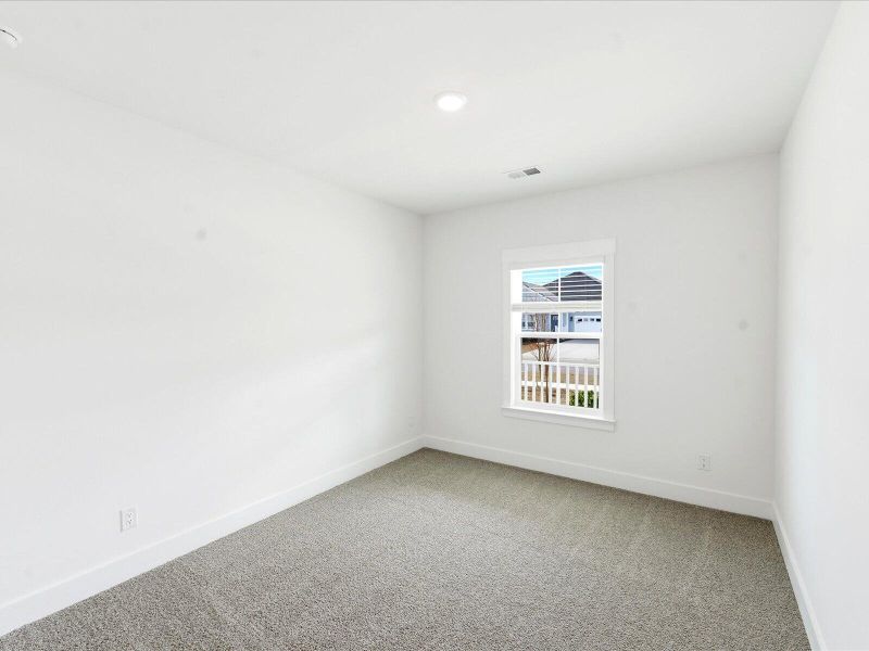 Spacious, unfurnished interior of a new home in The Coves at Lakes of Cane Bay II, Summerville (Image 31).