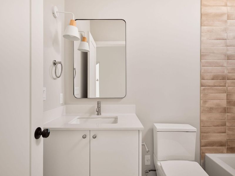 Full bathroom featuring vanity and  shower combination