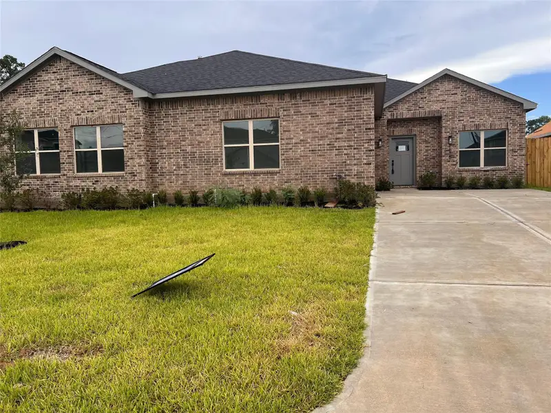 Front exterior of a new home in , Spring, TX, highlighting curb appeal (Image 2).