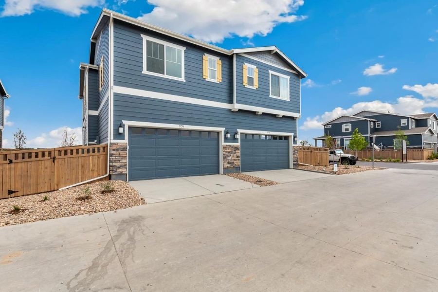 Front exterior of a new home in Painted Prairie Villas, Aurora, CO, highlighting curb appeal (Image 2). Front exterior of a new home in Painted Prairie Villas, Aurora, CO, highlighting curb appeal (Image 2).