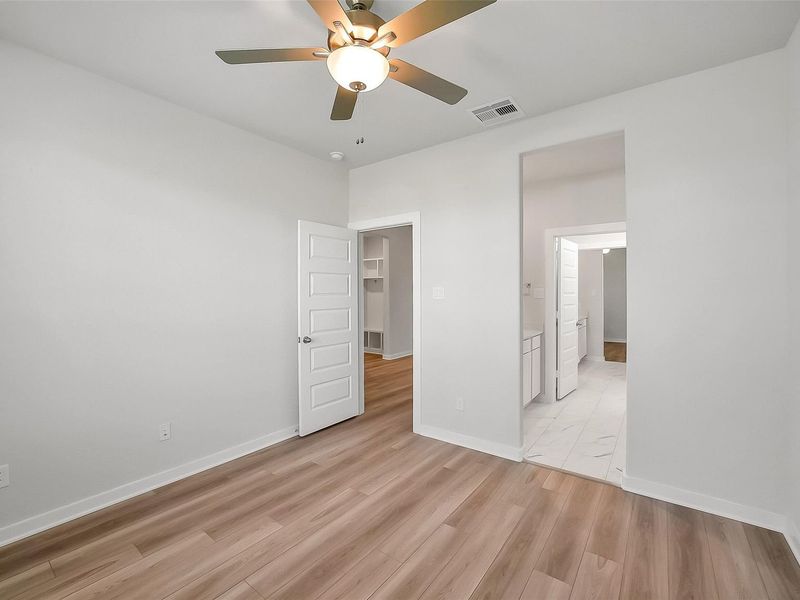 Spacious, unfurnished interior of a new home in Sunterra, Katy (Image 41).